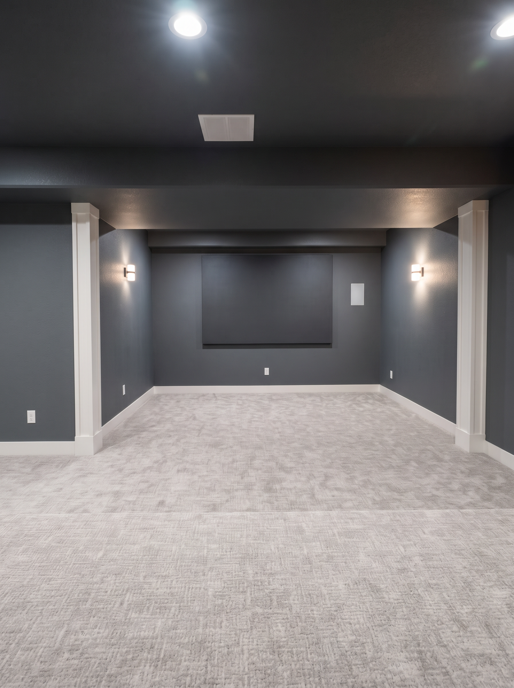 Finished basement theatre room with charcoal walls